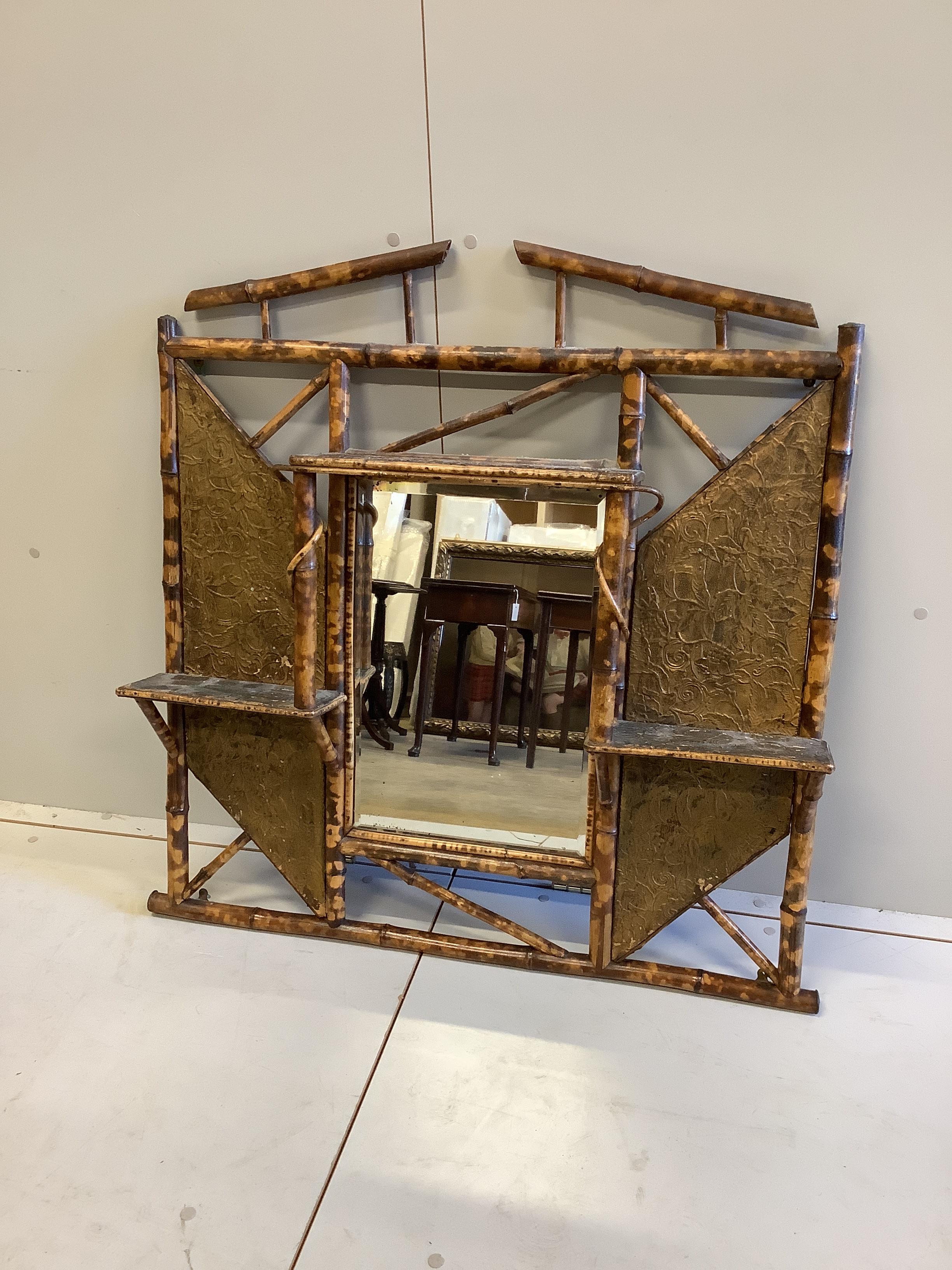 Two late Victorian bamboo hallstands and a bamboo wall mirror, largest width 120cm, height 186cm